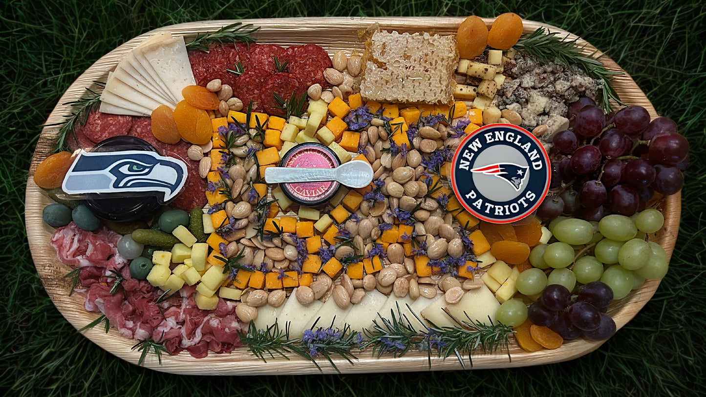 Charcuterie board with Super Bowl LX theme on a grass background