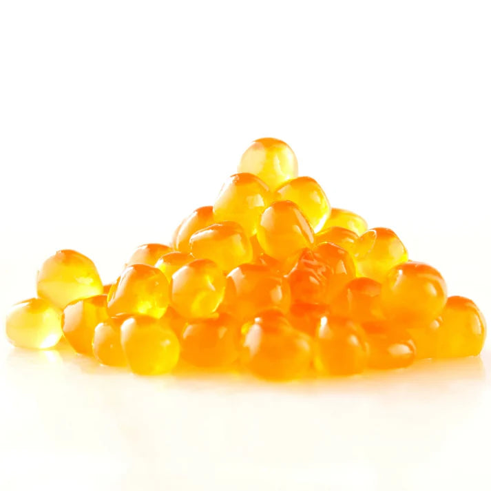 A small pile of translucent orange-yellow salmon roe on a clean white background.