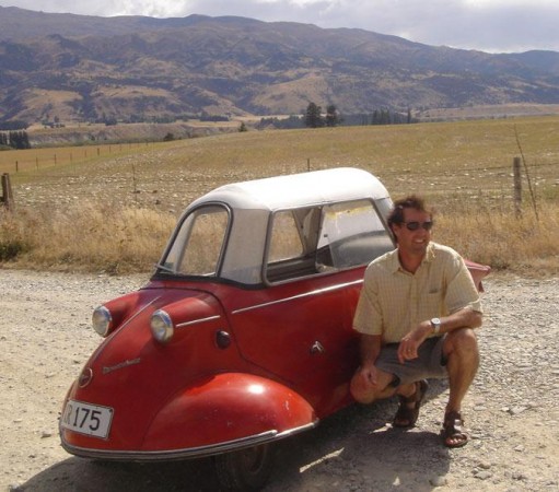 Blair, the Winemaker at Felton Road Winery, next to his odd, one-man car from the 1950s