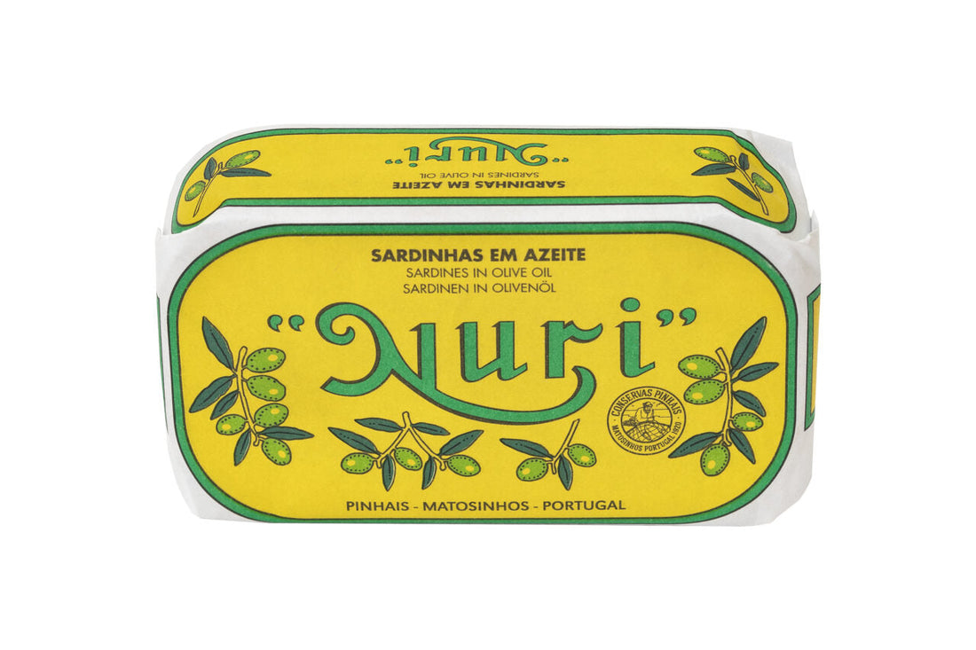 Yellow Nuri sardines in olive oil tin with green lettering and olive illustrations