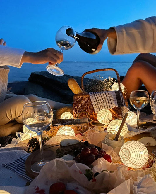 pouring wine at the beach
