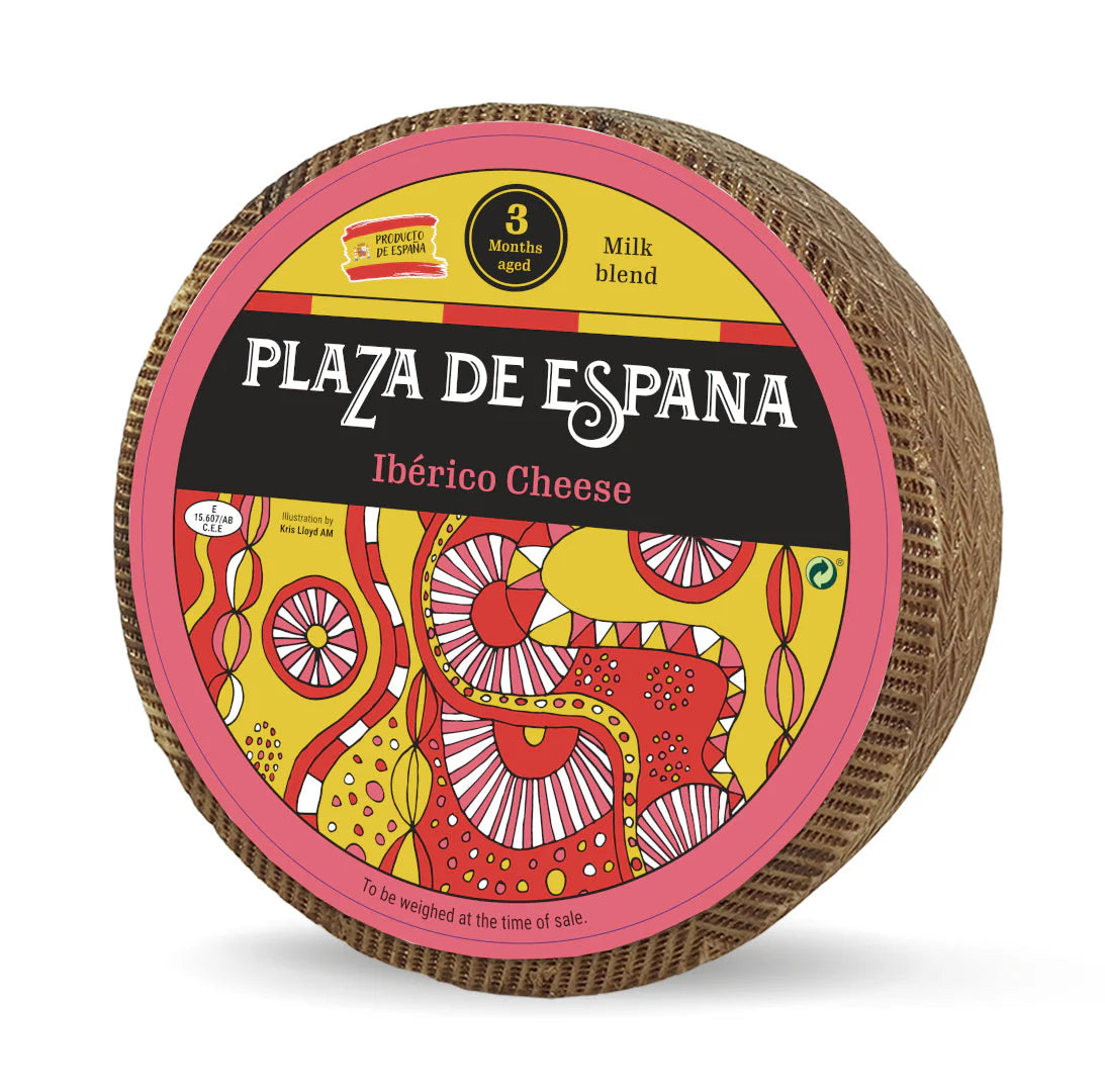 A whole wheel of Plaza de Espana Iberico Cheese wheel with colorful packaging on a white background