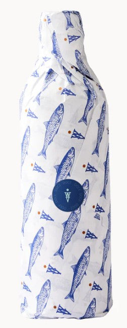 A bottle of the Wildly Virgin Olive Oil 'Doce' (2025), wrapped in tissue paper Decorated.with sardine images.