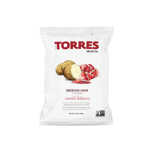 Bag of Torres Iberian Ham flavored potato chips. A white bag with red title font and a drawing of a potato next to Iberian Ham slices.
