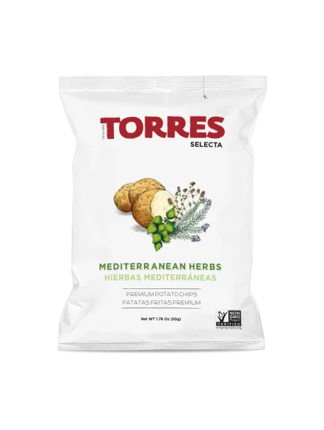 A white bag of Torres Selecta Mediterranean Herbs potato chips on a plain white background. The packaging features the red 'TORRES' brand name, green and brown illustrations of potatoes and herbs, and text indicating 'MEDITERRANEAN HERBS HIERBAS MEDITERRANAE'.