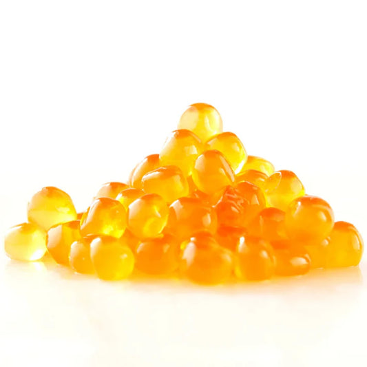 A small pile of translucent orange-yellow salmon roe on a clean white background.